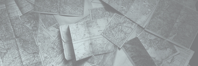 Maps Spread out on a Table